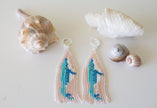 Handmade beaded fringe earrings with blue whales. 