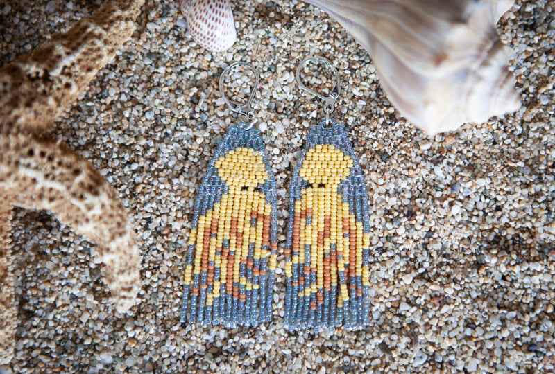 Beaded earrings with a beach theme on sand. Handmade fringe earrings with an octopus. 