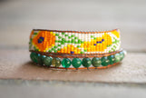 A fun California poppy beaded double wrap bracelet, handmade by NorthPeak Silver and Beadwork. 