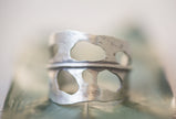 Sterling Silver adjustable handmade ring that looks like a Monstera Leaf, aka swiss cheese plant. 