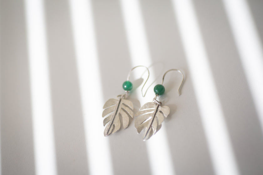 Sterling Silver Monstera Deliciosa leaf earrings, handmade with Green Mica beads. 