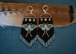 Luna moth beaded fringe earrings in silver, black, green, and blue with sterling silver plated ear hooks. 