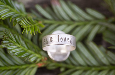 A ring with the band stamped with the words she loved