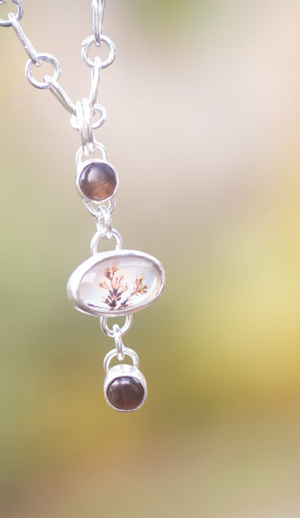 Handmade sterling silver pendant and chain with a dendritic agate doublet and smokey quartz. 