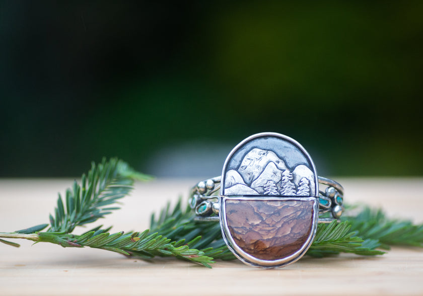 Large handmade unique sterling silver cuff with a mountain scene. Includes a half circle shaped Deschutes picture jasper from Oregon and Kingman turquoise. 