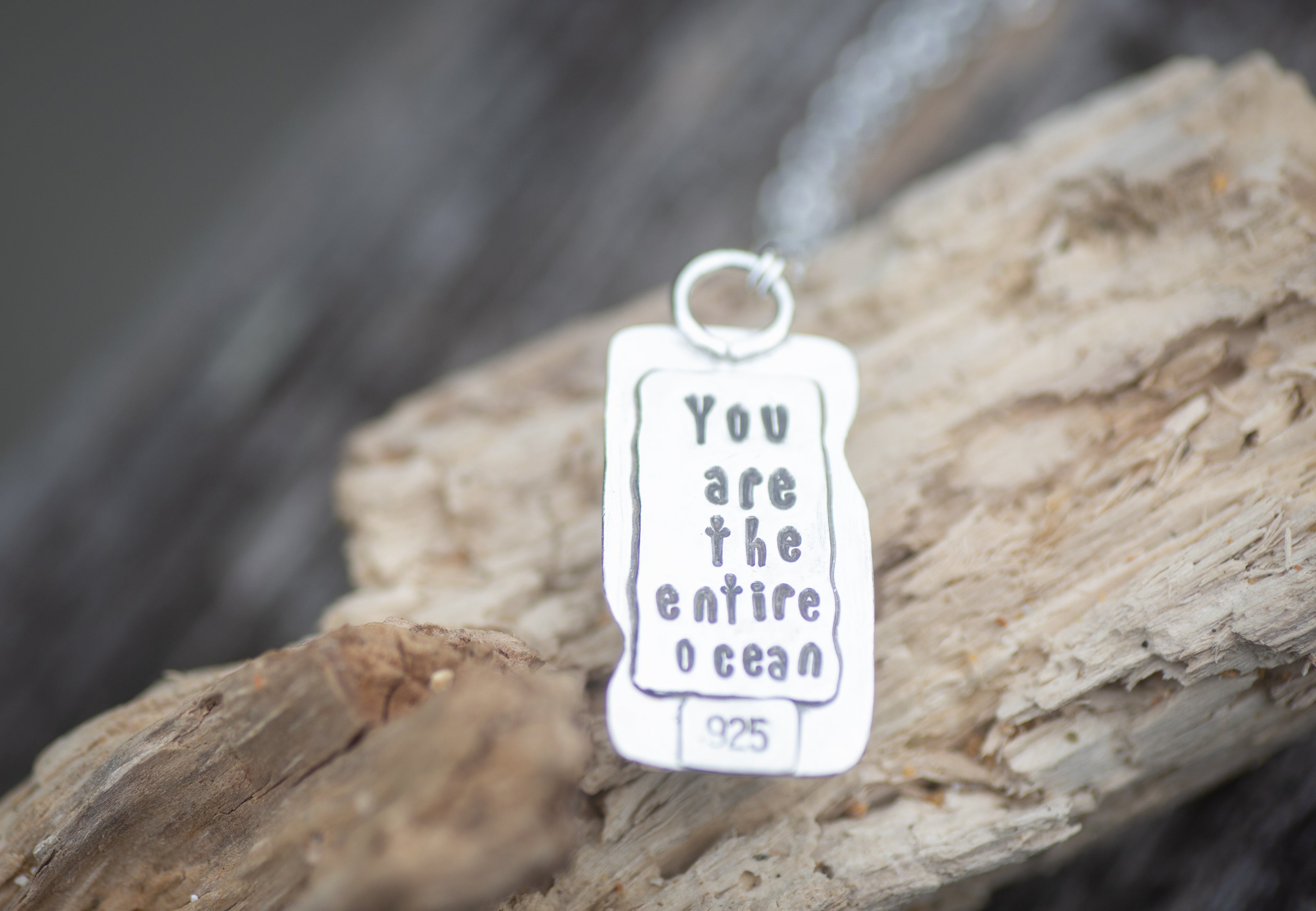 A Sterling Silver pendant with the Rumi quote 