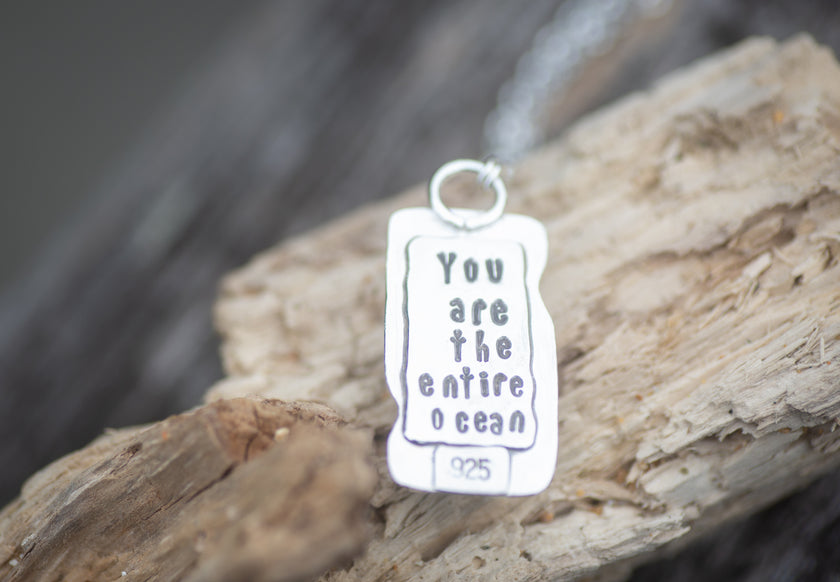 A Sterling Silver pendant with the Rumi quote 